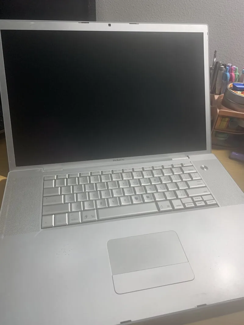 a 17 inch 2007 macbook pro open on a desk.